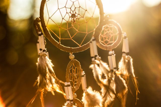 Dreamcatcher With Feathers Hanging in Sunlight with Lens Flare - Download Free Stock Photos Pikwizard.com
