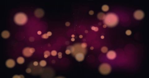 Glowing light spots on black background