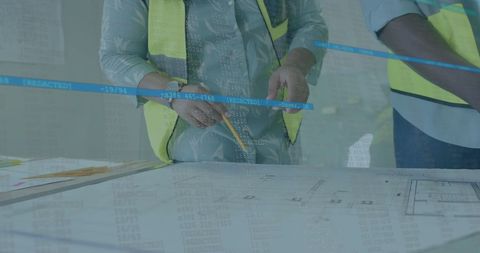Engineers Collaborating Over Blueprints with Data Overlay - Download Free Stock Images Pikwizard.com