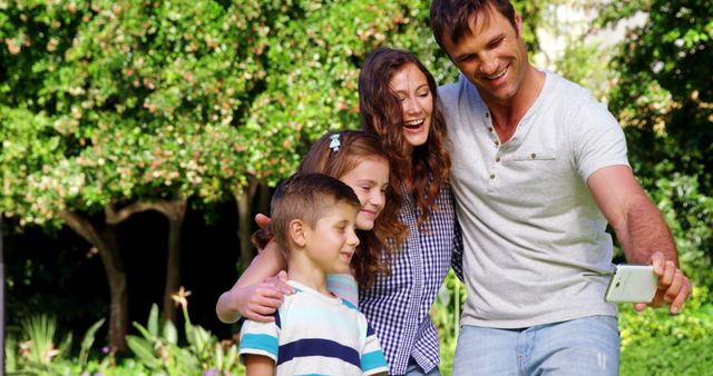 Happy Family Taking Selfie in Green Park - Download Free Stock Images Pikwizard.com