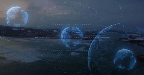 Abstract holographic globes hovering over tranquil coastal bay at dusk