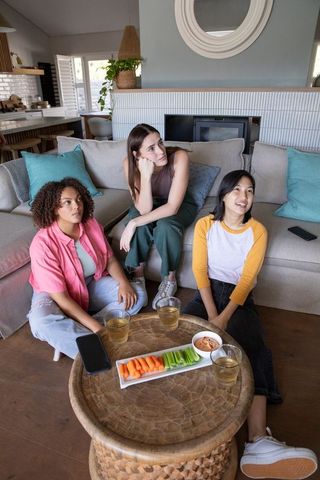 Diverse Friends Chatting Enjoying Time with Vegetarian Snacks Home Interior