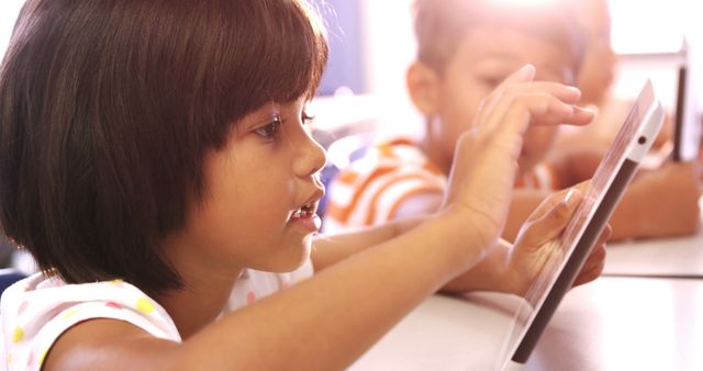 Young Child Using Tablet in Classroom - Download Free Stock Photos Pikwizard.com