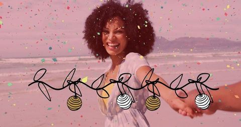 Joyful Woman Leading Partner on Beach with Ornaments and Confetti
