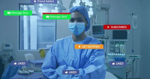 Female surgeon standing in operating room wearing mask with ar notification overlays