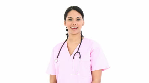 Young Nurse Smiling with Stethoscope in Pink Scrubs