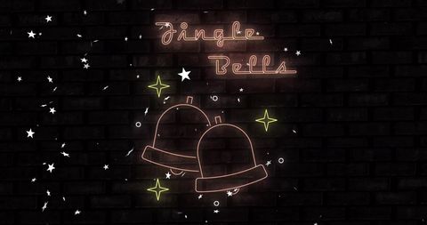 Festive neon jingle bells decoration on brick background