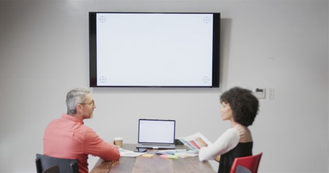 Business Meeting with Blank Presentation Screen - Download Free Stock Images Pikwizard.com