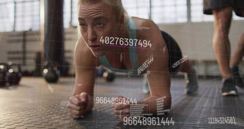Performing forearm plank with digital hud overlay in industrial gym for core training
