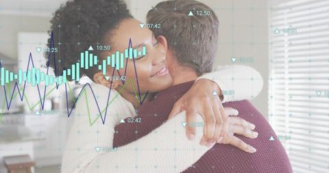 Couple hugging in cozy kitchen with digital financial charts and data overlays