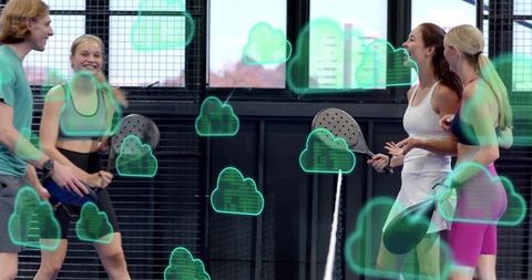 Group playing paddle on indoor court with holographic augmented reality cloud overlays
