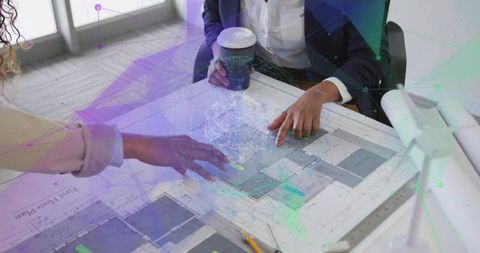 Business Professionals Collaborating on Architectural Plans