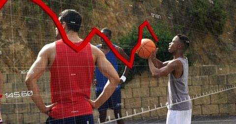 Shooting street basketball while red financial graph overlay illustrating analytics