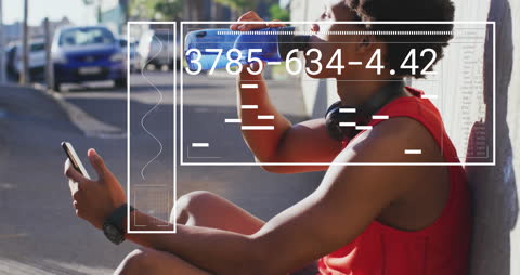 African American Man Hydrating After Intense City Run