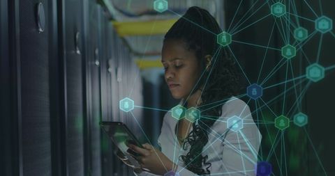 african american it specialist working in server room with network overlay - Download Free Stock Images Pikwizard.com