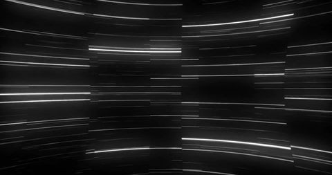 Dynamic glowing light trails over dark background