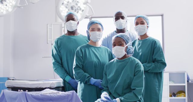 Image portrait of diverse group of surgeons ready for surgery in operating theatre. Hospital, medical and healthcare services.