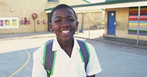 Smiling African American Schoolboy with Backpack Outdoors - Download Free Stock Images Pikwizard.com
