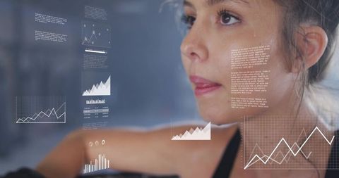 Young woman analyzing augmented reality fitness data during intense strength training