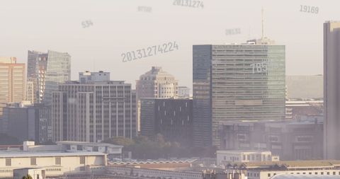 Futuristic Digital Data Overlay on Modern City Skyline
