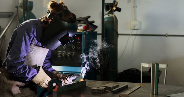 Female Welder Working with Metal in Industrial Workshop - Download Free Stock Images Pikwizard.com