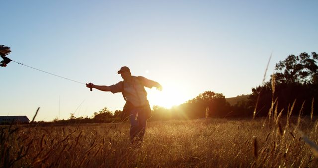 Man Falconer Training Bird of Prey at Sunset in Open Field - Download Free Stock Images Pikwizard.com