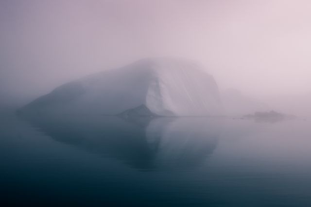 Misty Iceberg in Tranquil Arctic Waters at Dawn - Download Free Stock Photos Pikwizard.com