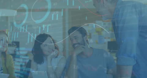 Diverse Business Team Analyzing Financial Data Graphs