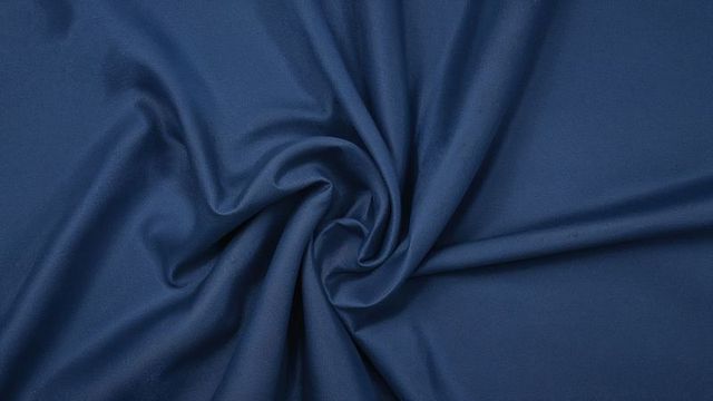 Swirled Blue Fabric with Smooth Folds and Subtle Sheen