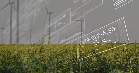 Renewable energy data overlay on rapeseed field with wind turbines and technical ui