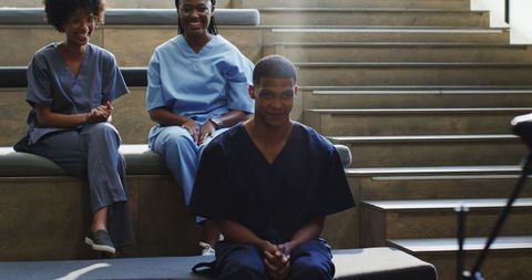 Man practicing public speaking in college auditorium