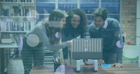 Business Team Analyzing Data Using Laptop in Modern Office