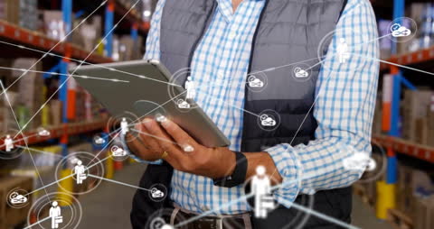 Digital Network Overlay with Person Using Tablet in Warehouse