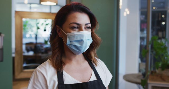 Female Barista Wearing Protective Face Mask in Coffee Shop - Download Free Stock Images Pikwizard.com