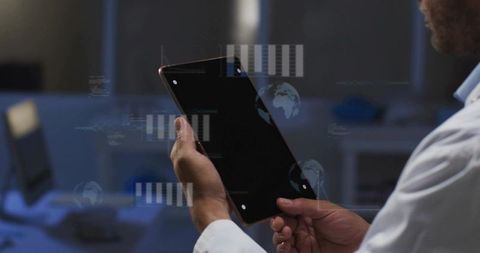 Scientist Holding Tablet with Holographic Data Overlay in High-Tech Research Laboratory
