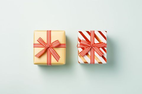 Colorful wrapped gift boxes with red ribbons bows photo