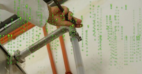 Technician securing pipeline amidst streaming binary code