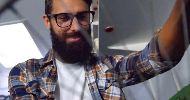 Bearded Man Fixing Bicycle in Workshop - Download Free Stock Images Pikwizard.com