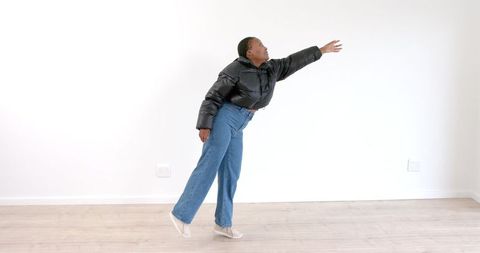 African American Woman Stretching in Living Room - Download Free Stock Images Pikwizard.com