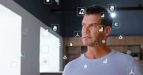 Businessman engaging with augmented reality icons