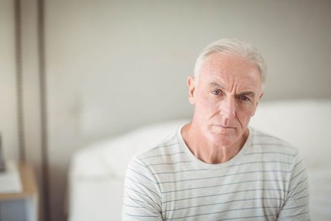 Senior Man in Striped Shirt Relaxing at Home