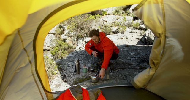 Camper Cooking Breakfast Near Tent in Rocky Terrain - Download Free Stock Images Pikwizard.com