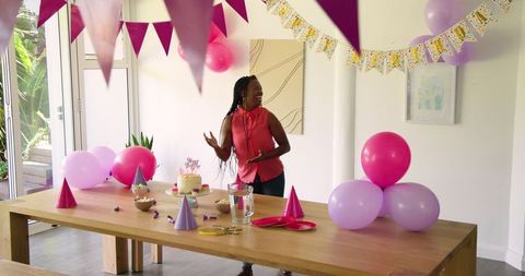 Joyful birthday decoration including banners and balloons