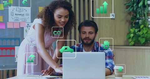 Team Analyzing Sustainability Data in Modern Office Setting
