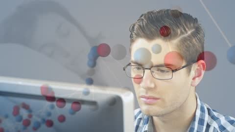 DNA Animation Over Man Working at Computer in Office Setting