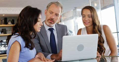 Business Meeting in Restaurant with Business Colleagues Collaborating