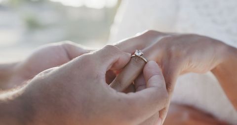 Couple Exchanging Rings at Romantic Beach Wedding Ceremony - Download Free Stock Images Pikwizard.com