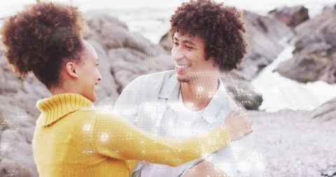Happy Couple beside Rocky Seashore Embracing Serenity and Joy