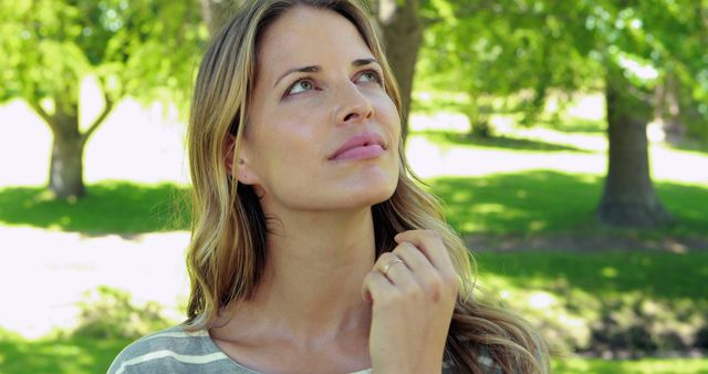 Thoughtful young woman enjoying nature in park - Download Free Stock Images Pikwizard.com