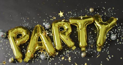 Gold Party Balloons with Confetti on Black Background